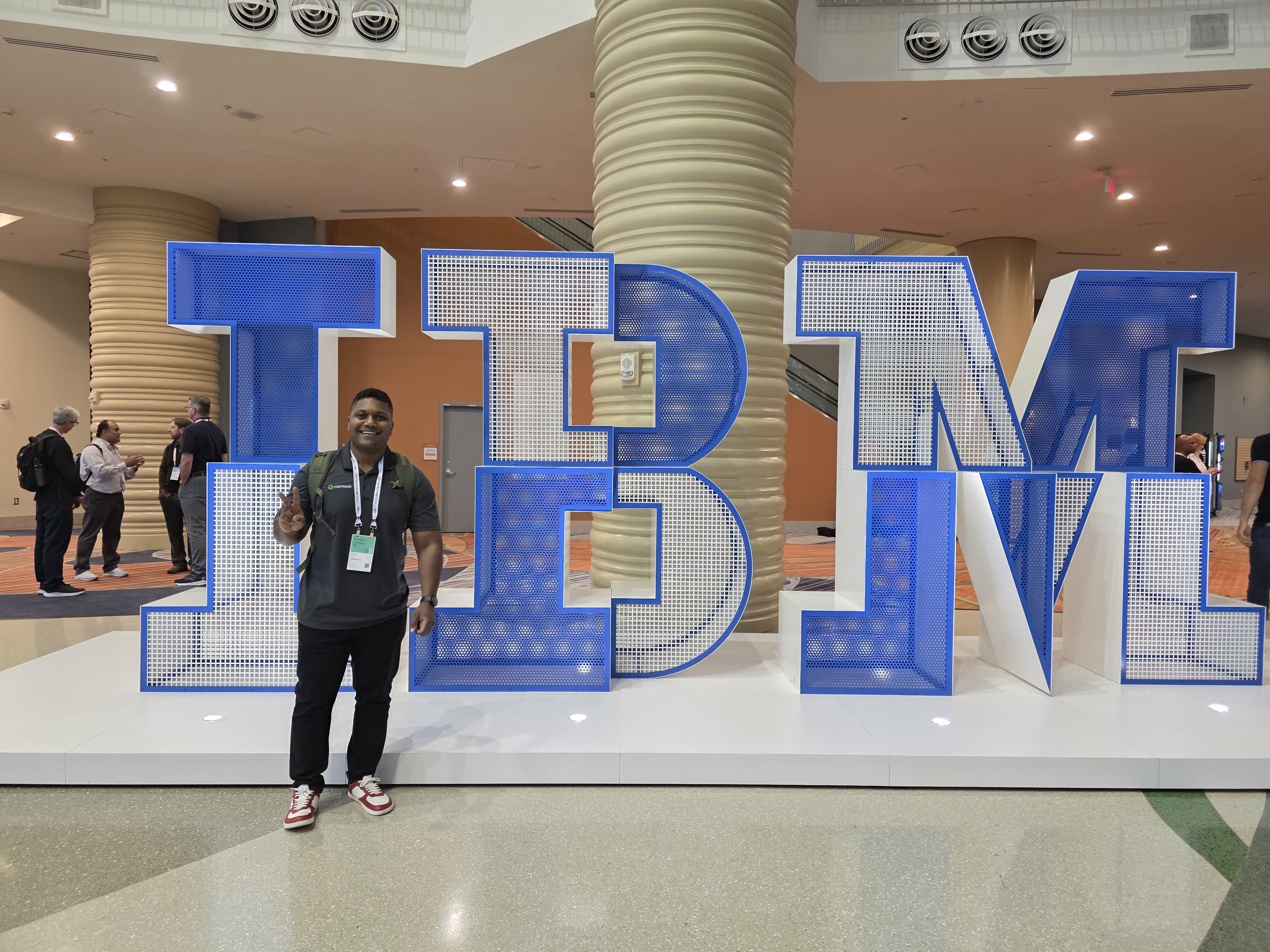 IBM TechxChange Orlando 2025 - at the iconic IBM logo display